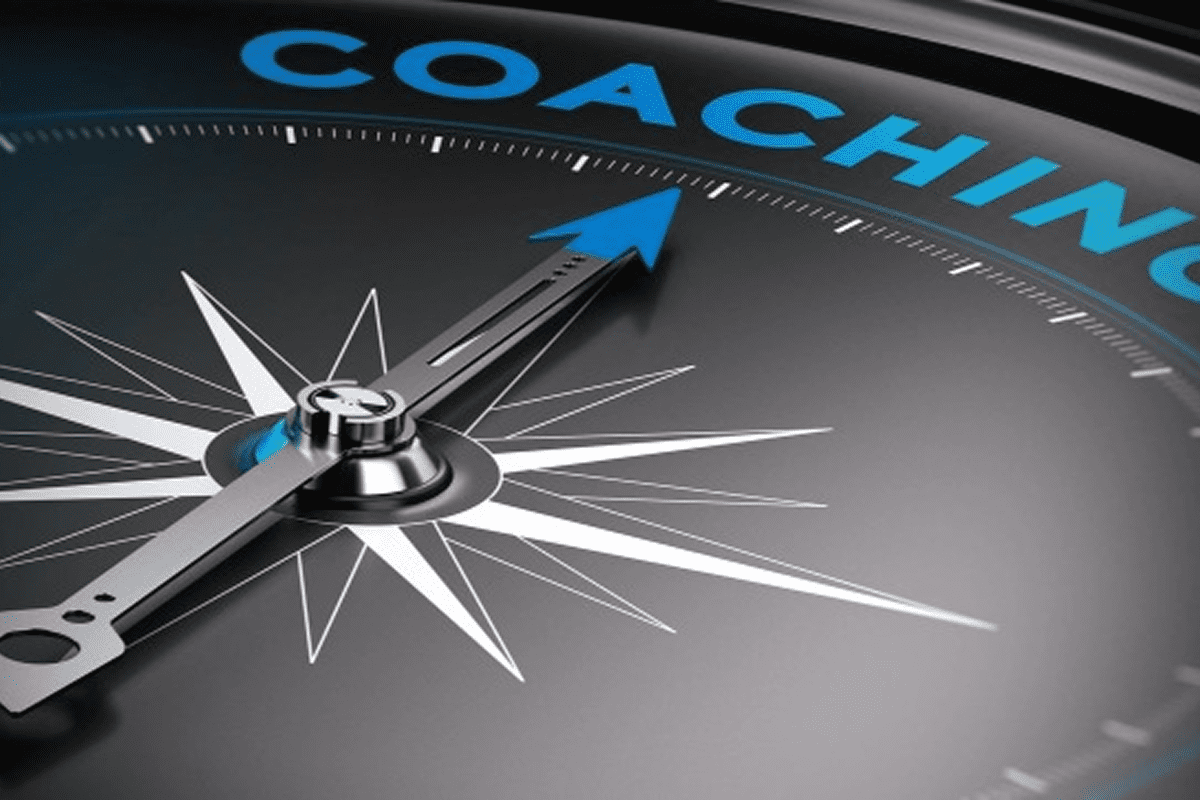 Compass pointing towards "Coaching" in blue text.