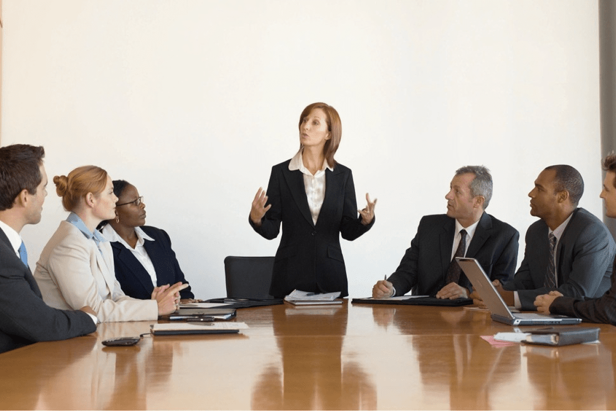 Business meeting with a woman leading discussion.